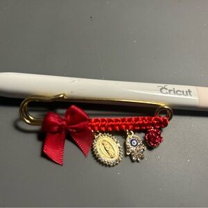 Gold Pin with Red Ribbon and Charms